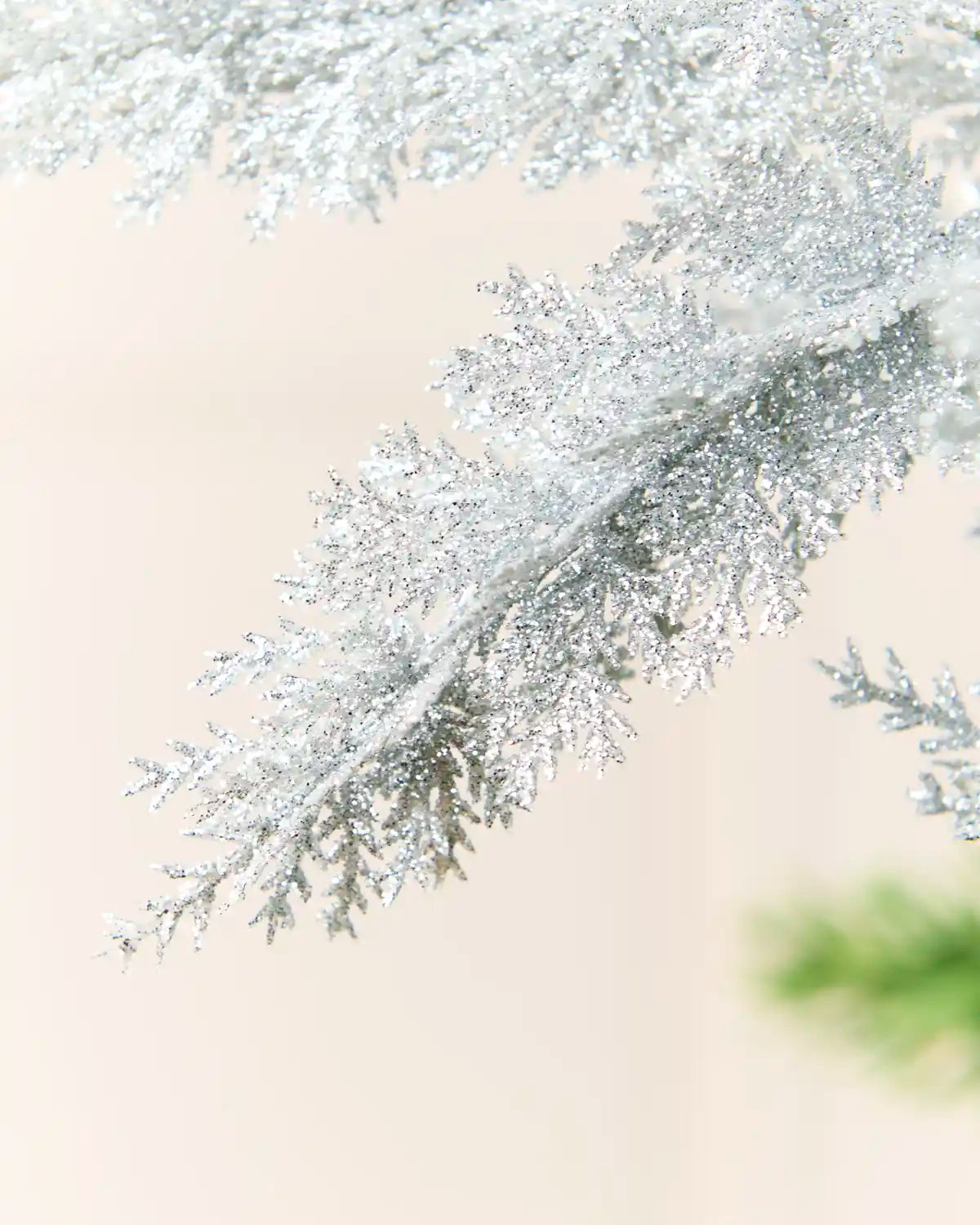 close-up of the Silver Christmas tree spray to highlight its textured, shimmering leaves