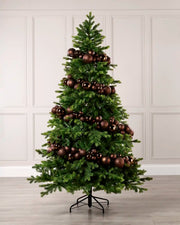 Espresso bauble garland wrapped around a green Christmas tree with shiny, matt and glitter baubles.