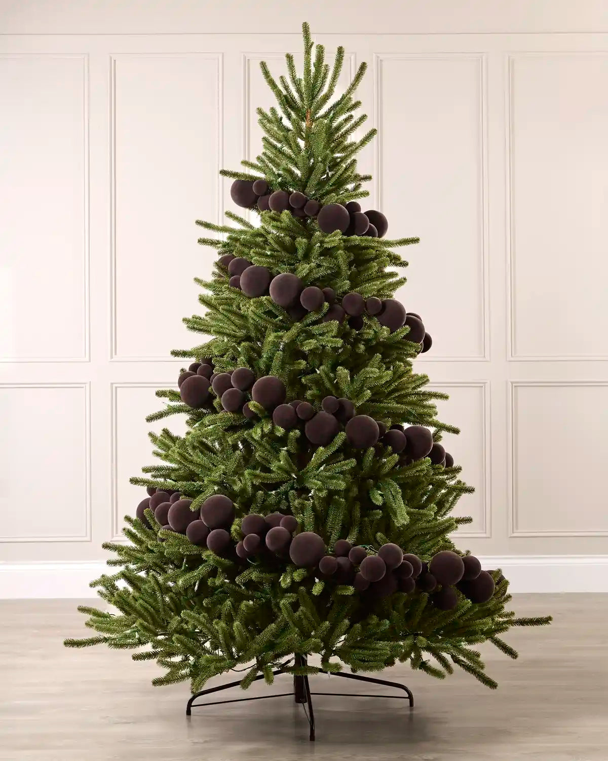 Espresso velvet bauble garland wrapped around a green Christmas tree with mixed 5cm, 7cm and 10cm baubles.