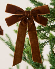 Espresso 16.5 cm velvet double bow with long tails attached to a Christmas tree branch.