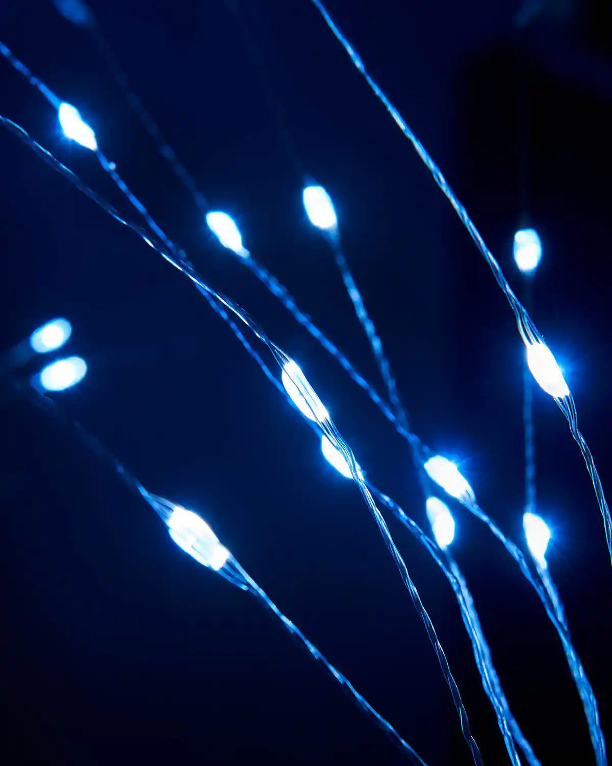 Detailed close-up of the glowing LED tips on the firework pathway lights