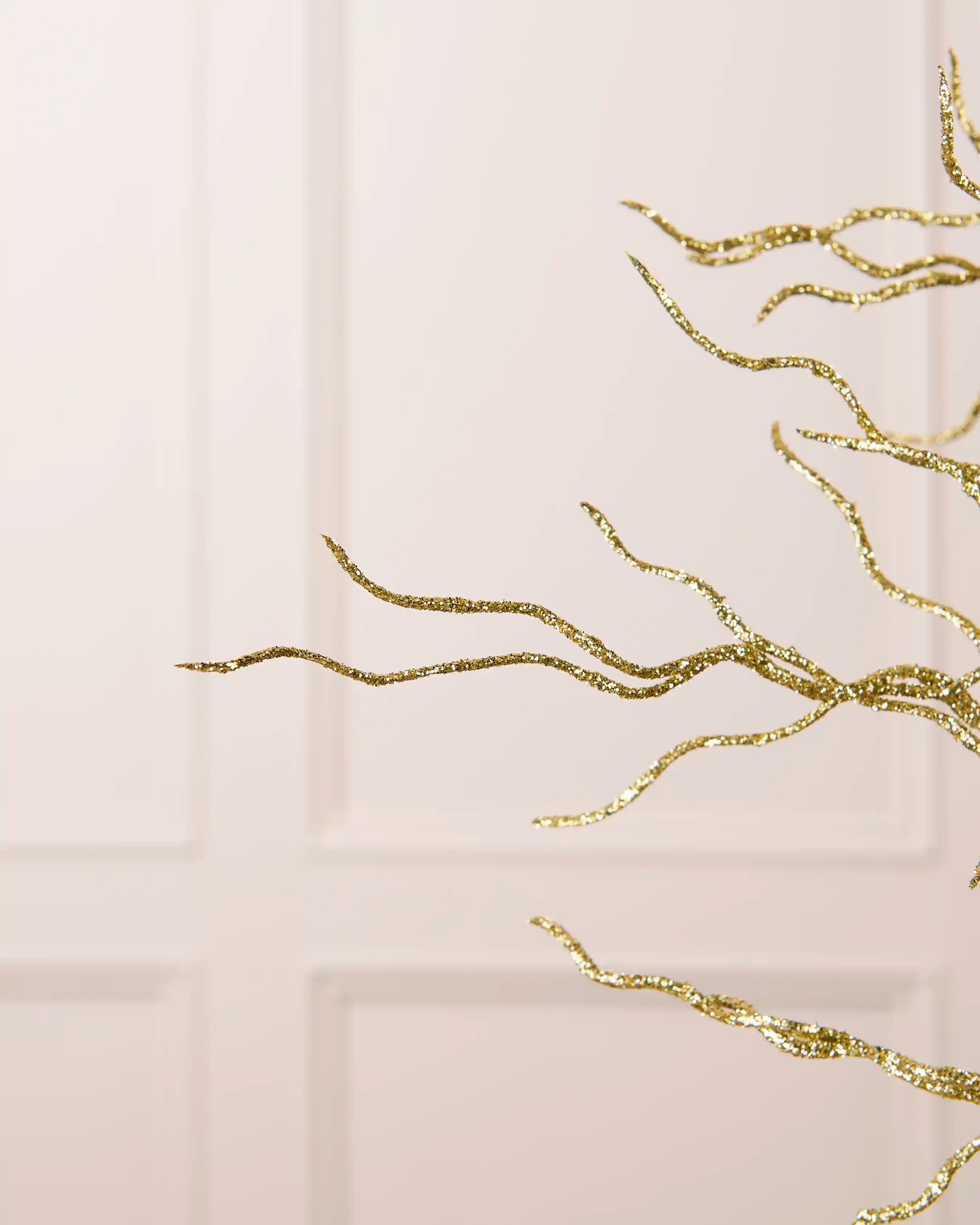 Close-up of the fine branching structure and gold glitter finish on the 90 cm twig tree topper.