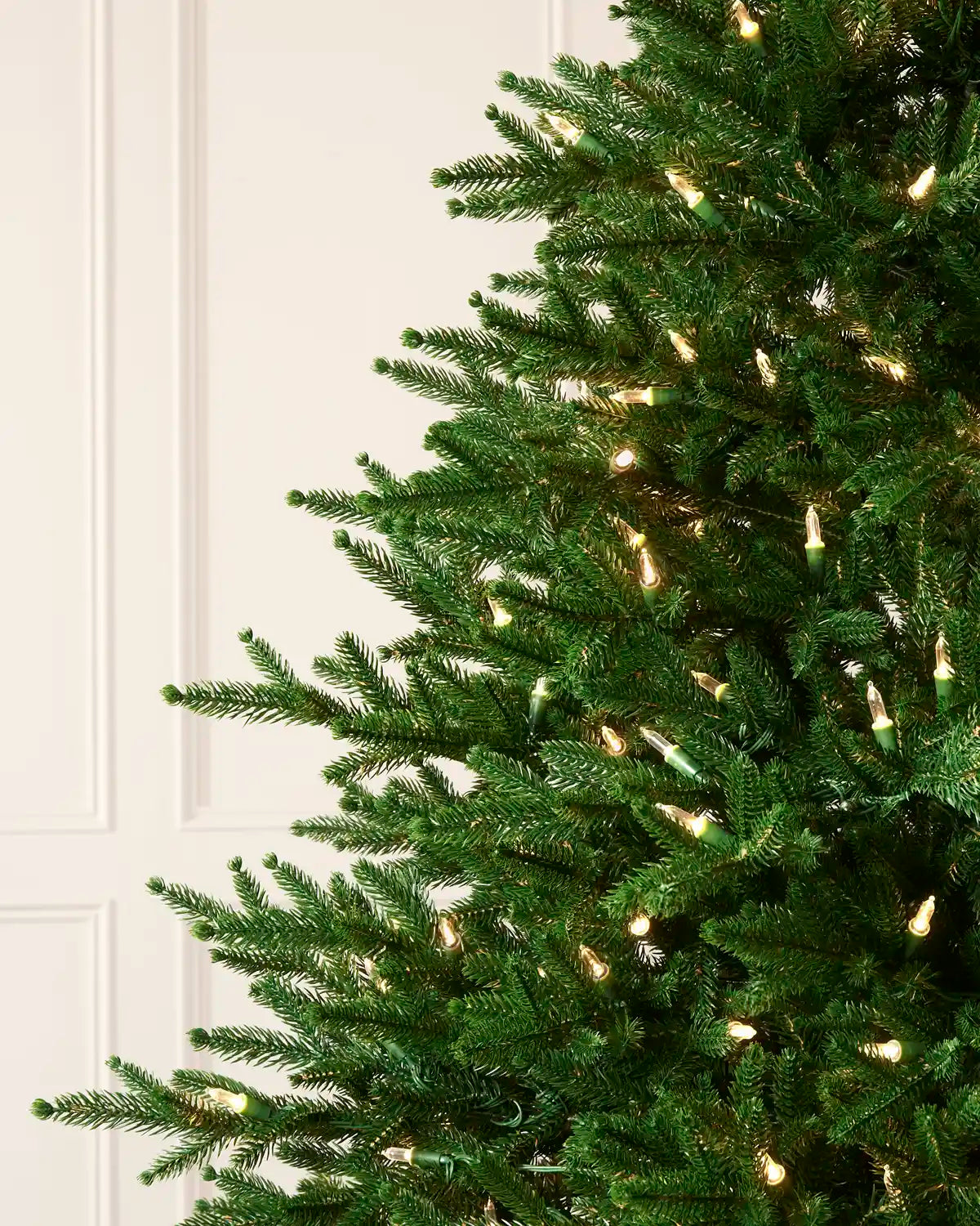 Close-up of the dense Heritage Spruce foliage and integrated warm white LED lights.