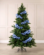 Ice blue bauble cluster arch styled around a green Christmas tree with shiny, matt and glitter baubles.