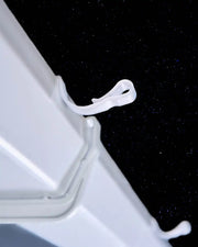 White large gutter hook clipped onto guttering