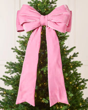 Large 140 cm pink velvet Christmas bow displayed on a decorated Christmas tree.
