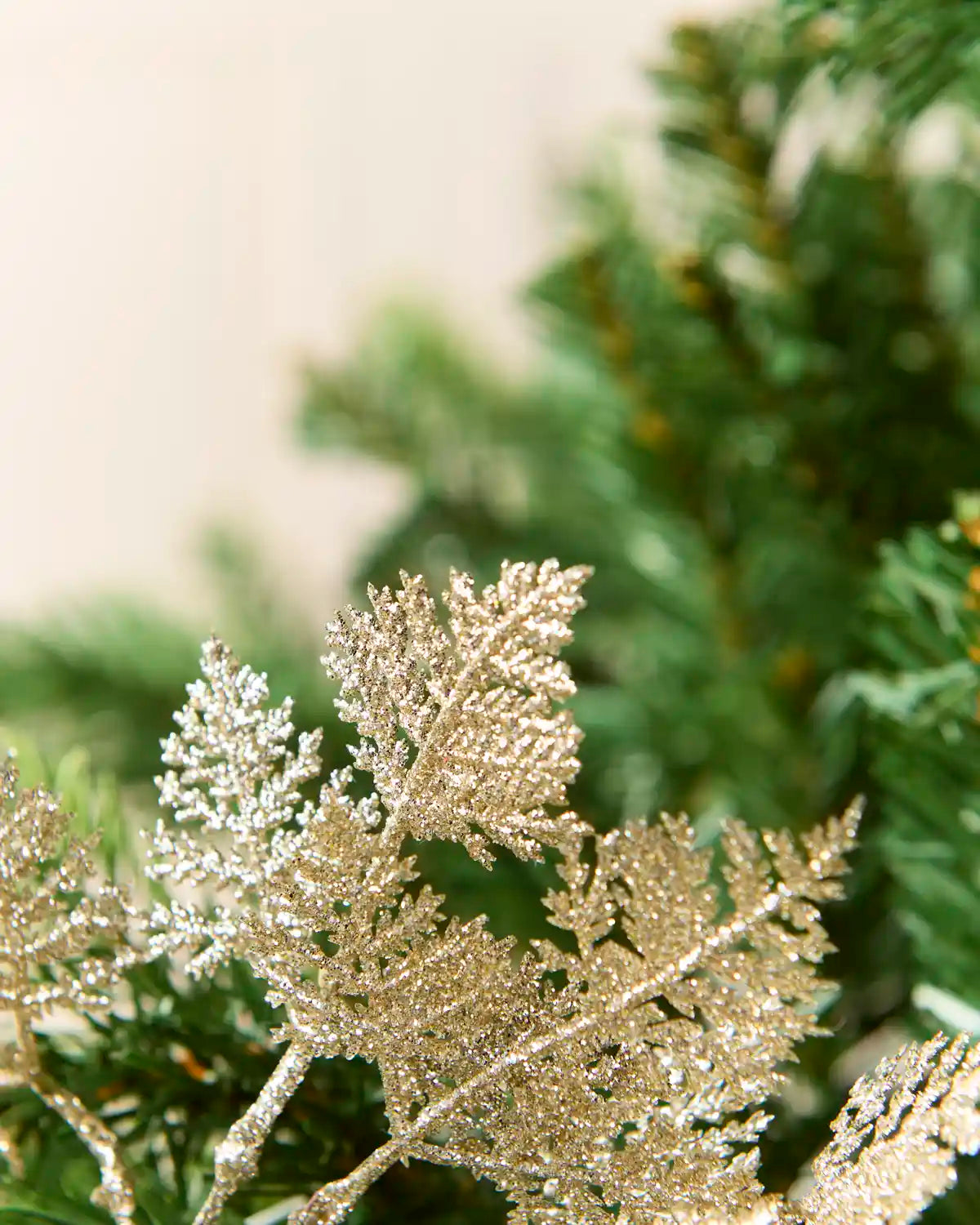 Detailed view of layered latte glitter leaves showing textured surfaces and delicate edges.