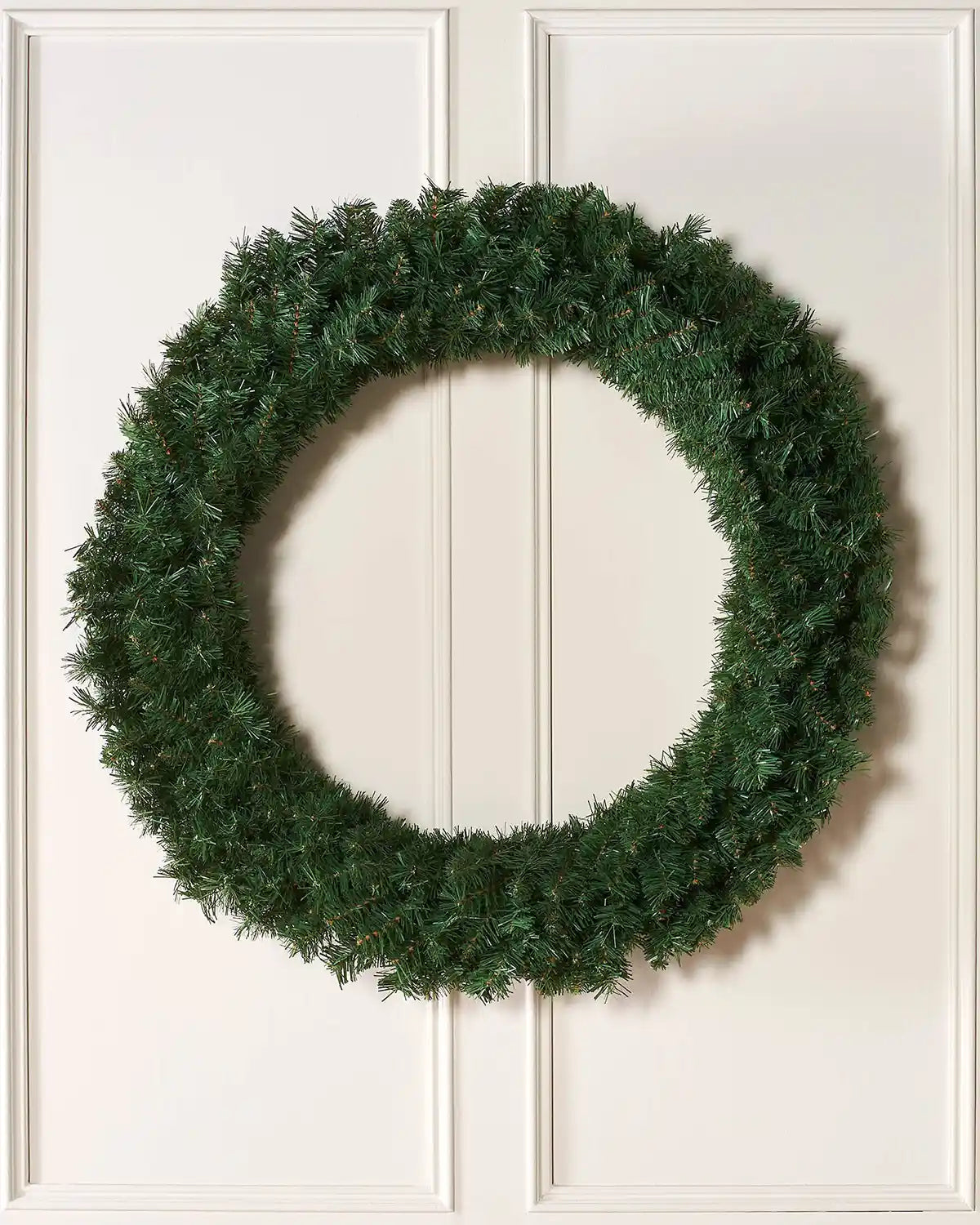 1 m majestic Christmas wreath displayed on a white panelled door