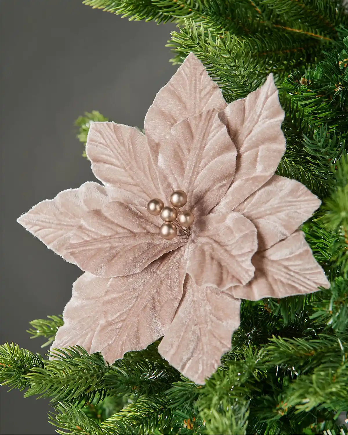 26 cm mocha artificial poinsettia flower displayed in a Christmas tree, with soft velvet-textured petals and pearl-style centre beads.