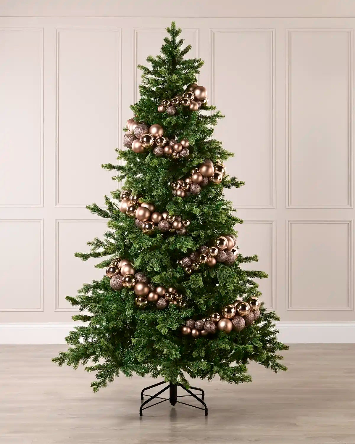 Mocha bauble cluster arch arranged around a green Christmas tree with shiny, matt and glitter baubles.