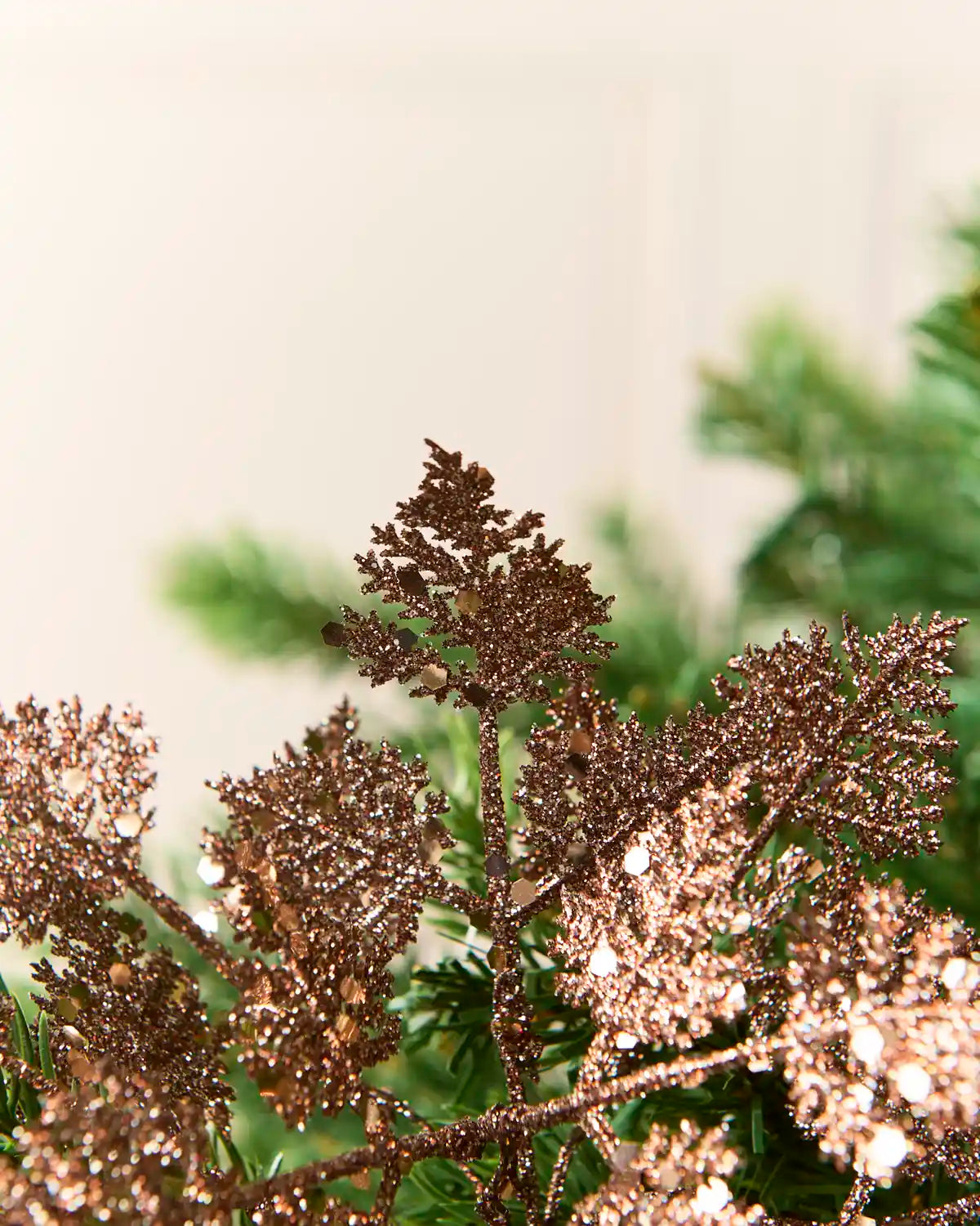 Detailed view of layered mocha glitter leaves showing textured surfaces and delicate edges.