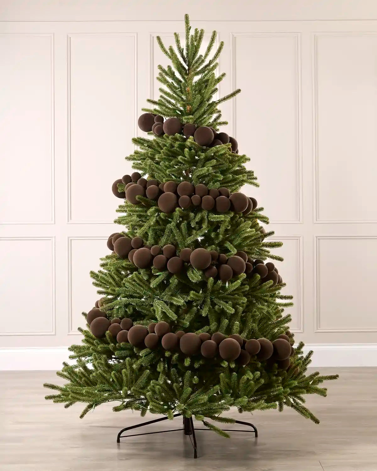 Mocha velvet bauble garland wrapped around a green Christmas tree with mixed 5cm, 7cm and 10cm baubles.