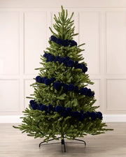 Navy velvet bauble garland wrapped around a green Christmas tree with mixed 5cm, 7cm and 10cm baubles.