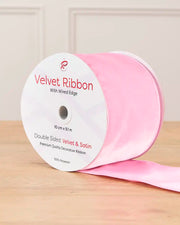 10 cm wide pink double-sided wired velvet ribbon on a 9 m roll with product label.
