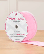 6 cm wide pink double-sided wired velvet ribbon on a 9 m roll with product label.