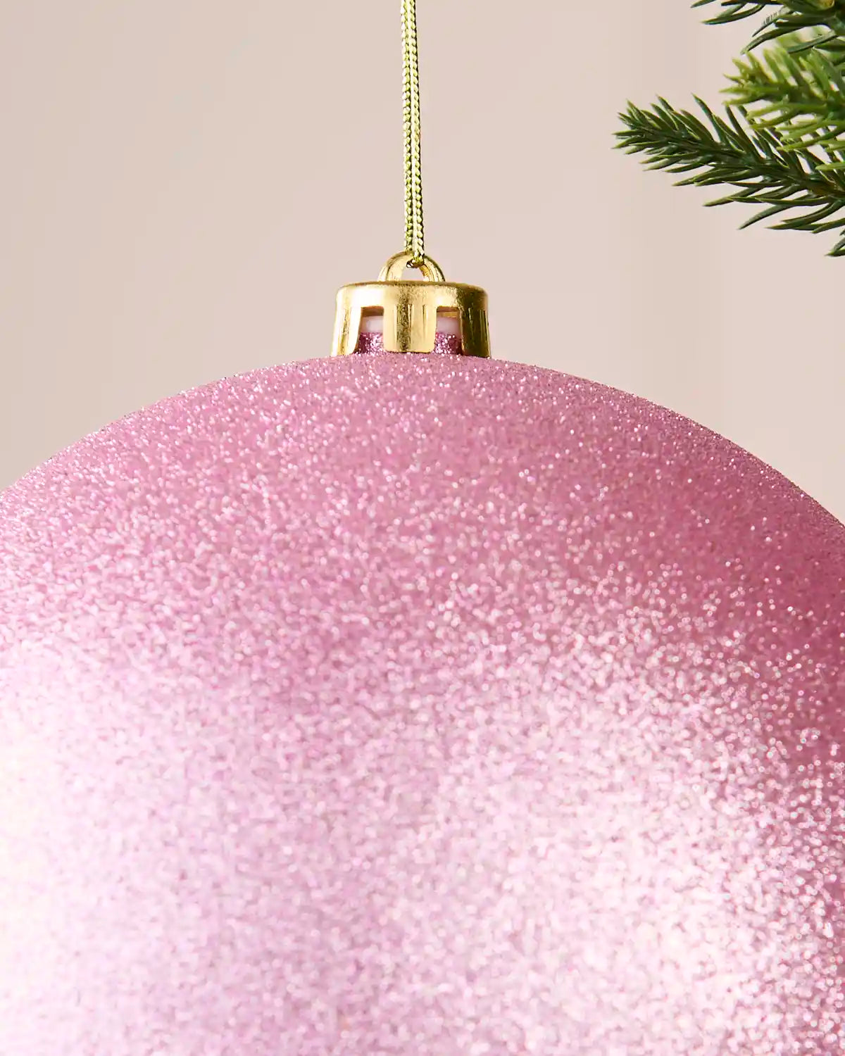 Detailed close-up of the 20 cm pink glitter shatterproof bauble showing the gold cap, hanging string and sparkling finish.