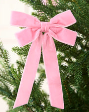 Pink 16.5 cm velvet double bow with long tails attached to a Christmas tree branch.
