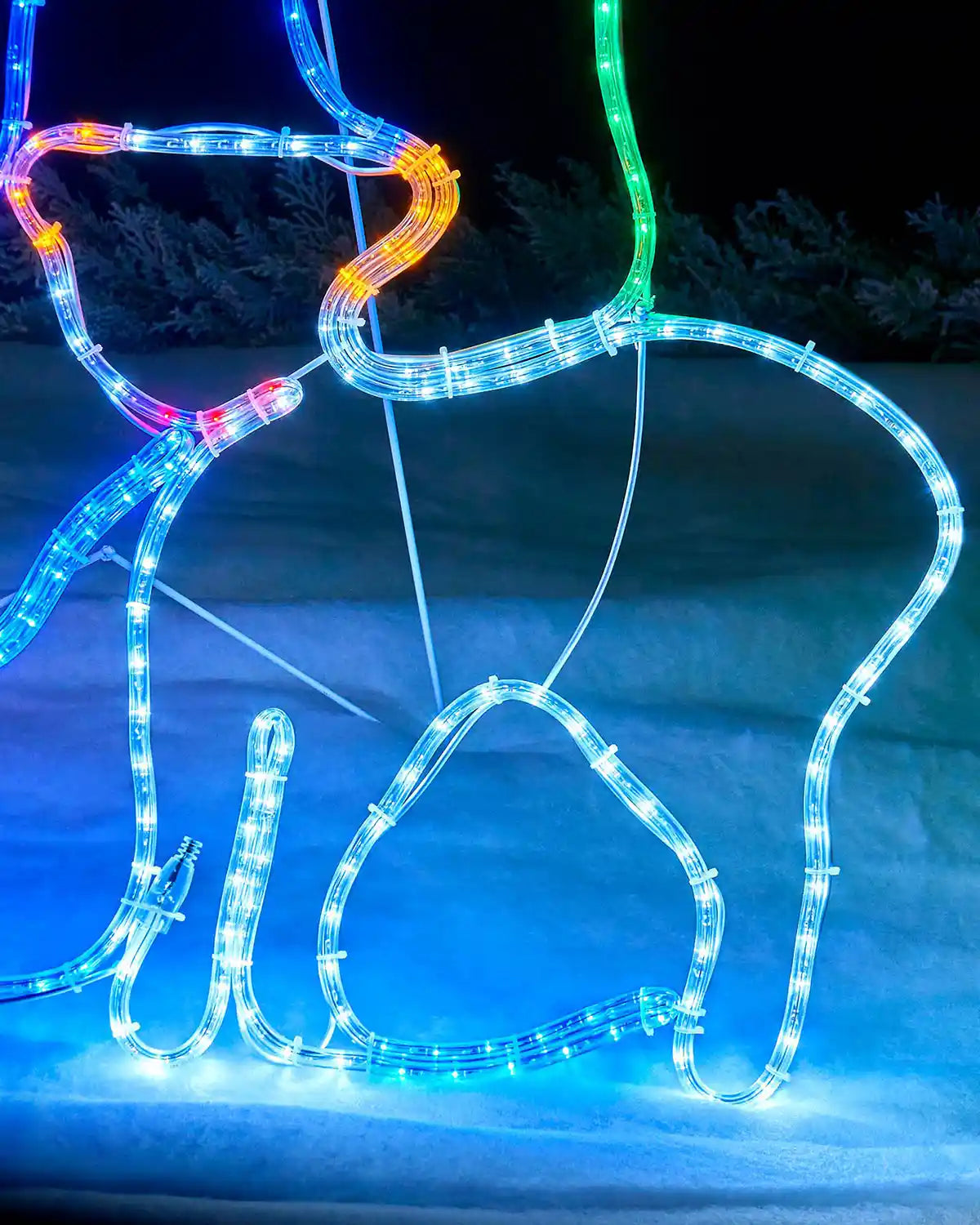 Close-up of the sheep figure illuminated with white and blue rope lights