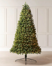 Pre-lit mixed pine half Christmas tree with warm white lights and a black metal tree stand.