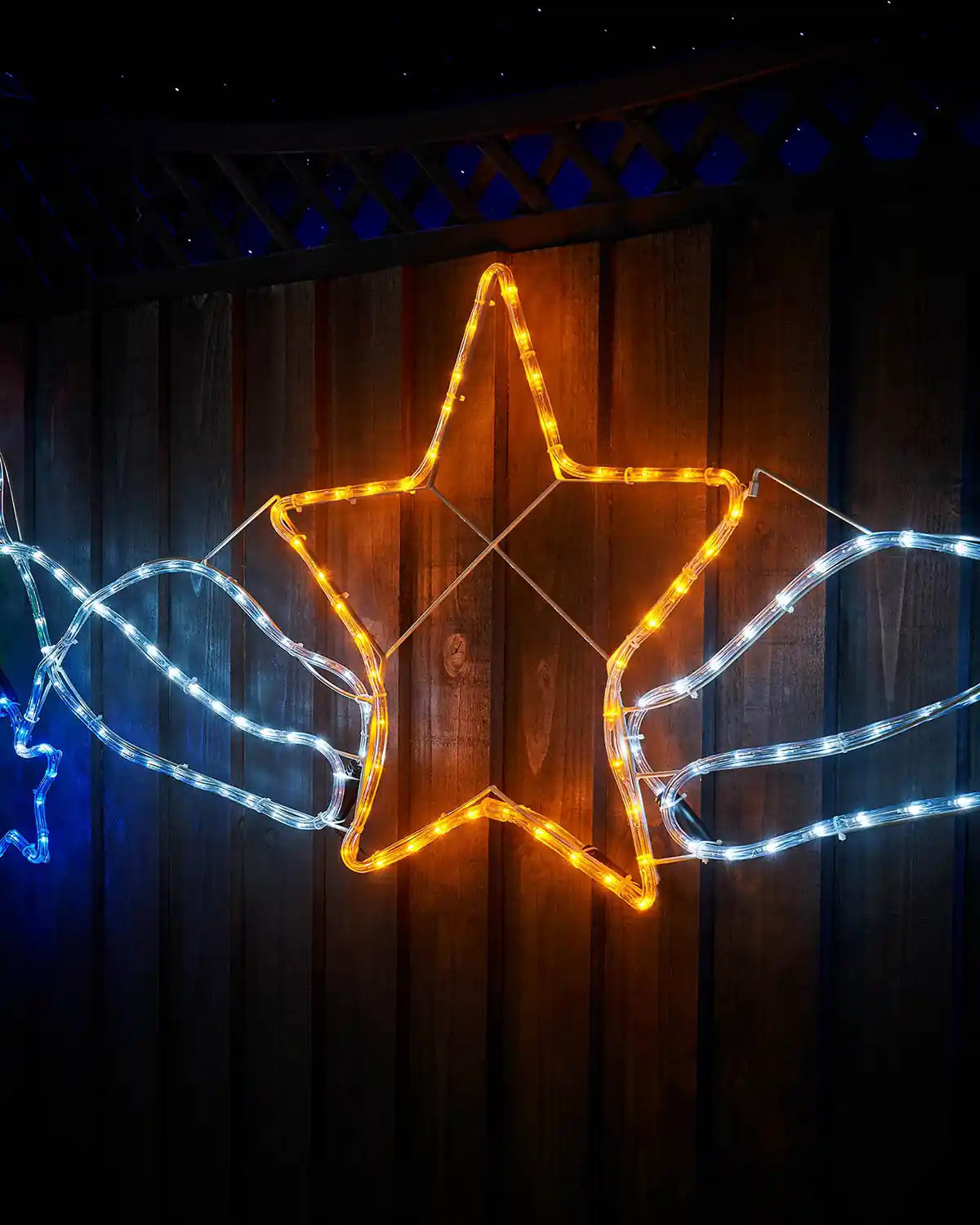 Close-up of the gold star and white rope lights on a 190 cm pre-lit multi-coloured star cluster silhouette