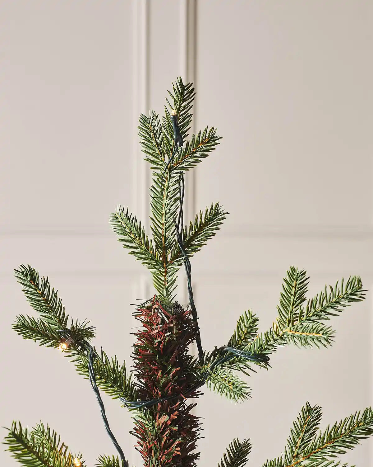 Close-up of the top branches of a 4 ft artificial Christmas tree