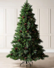 7.5 ft pre-lit Portland Spruce Christmas tree with pinecones and warm white lights in a room setting