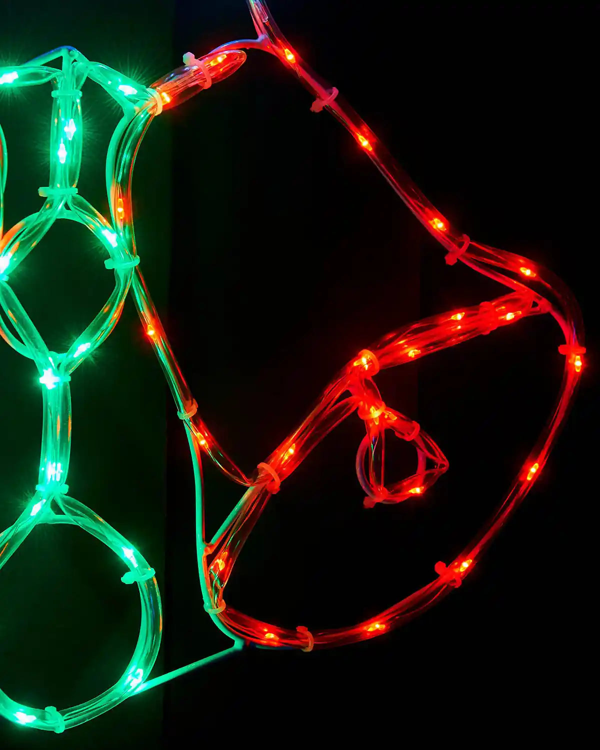 Close-up of the red and green rope light detail on the twin bells display