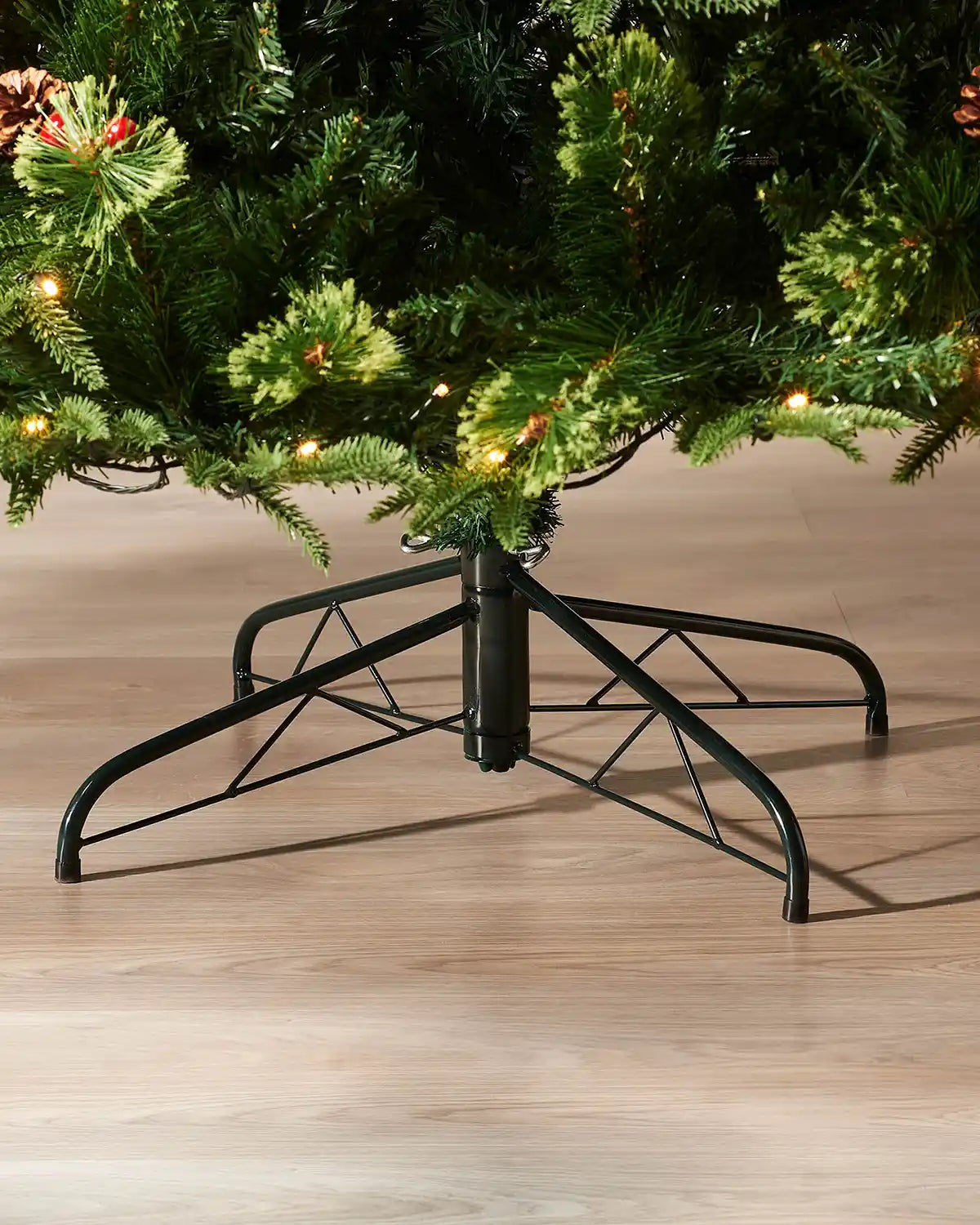 Foldable metal stand supporting the pre-lit Victorian mixed tip Christmas tree