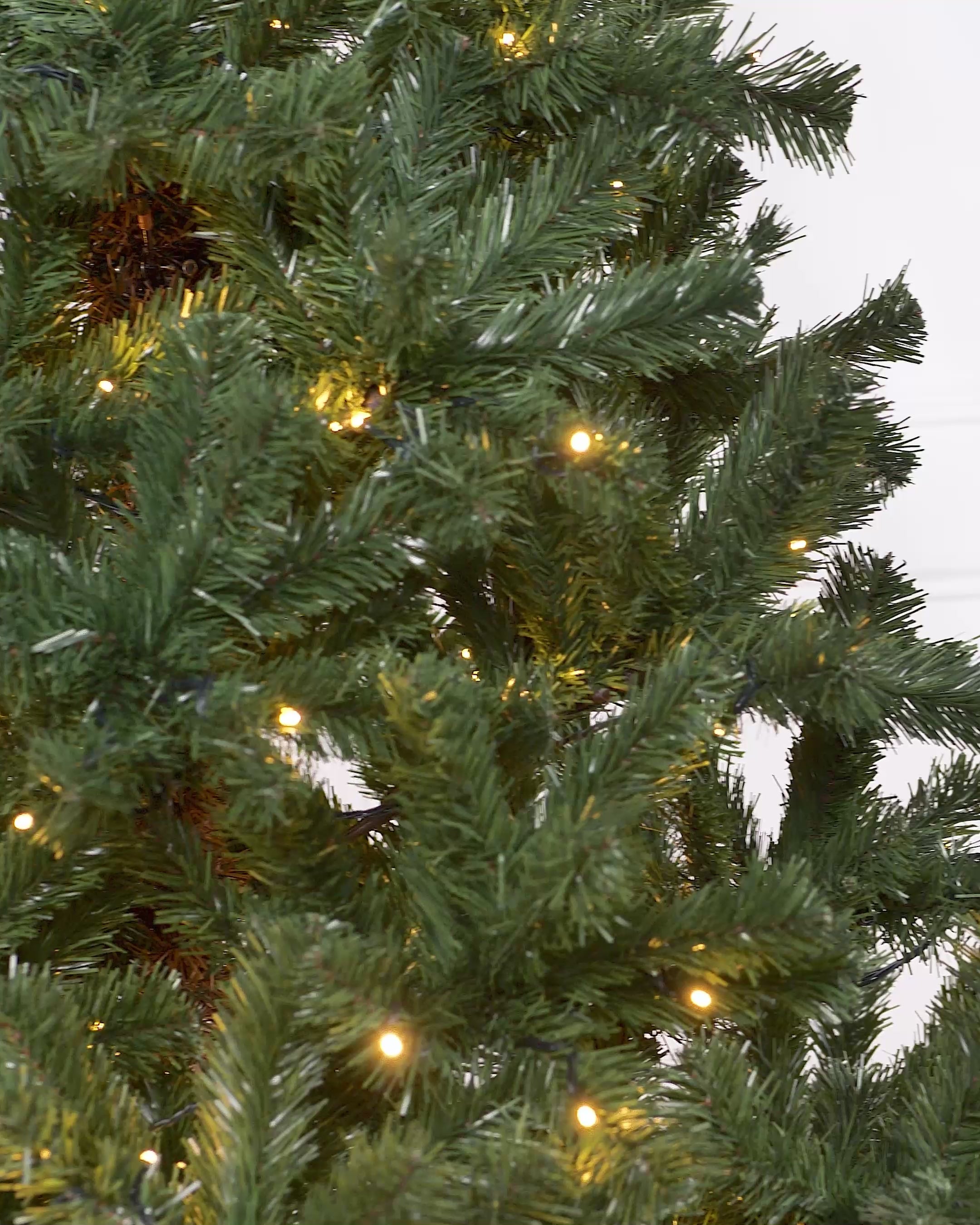 Load video: Pre-Lit Emerald Spruce Christmas Tree, Warm White, 7 ft