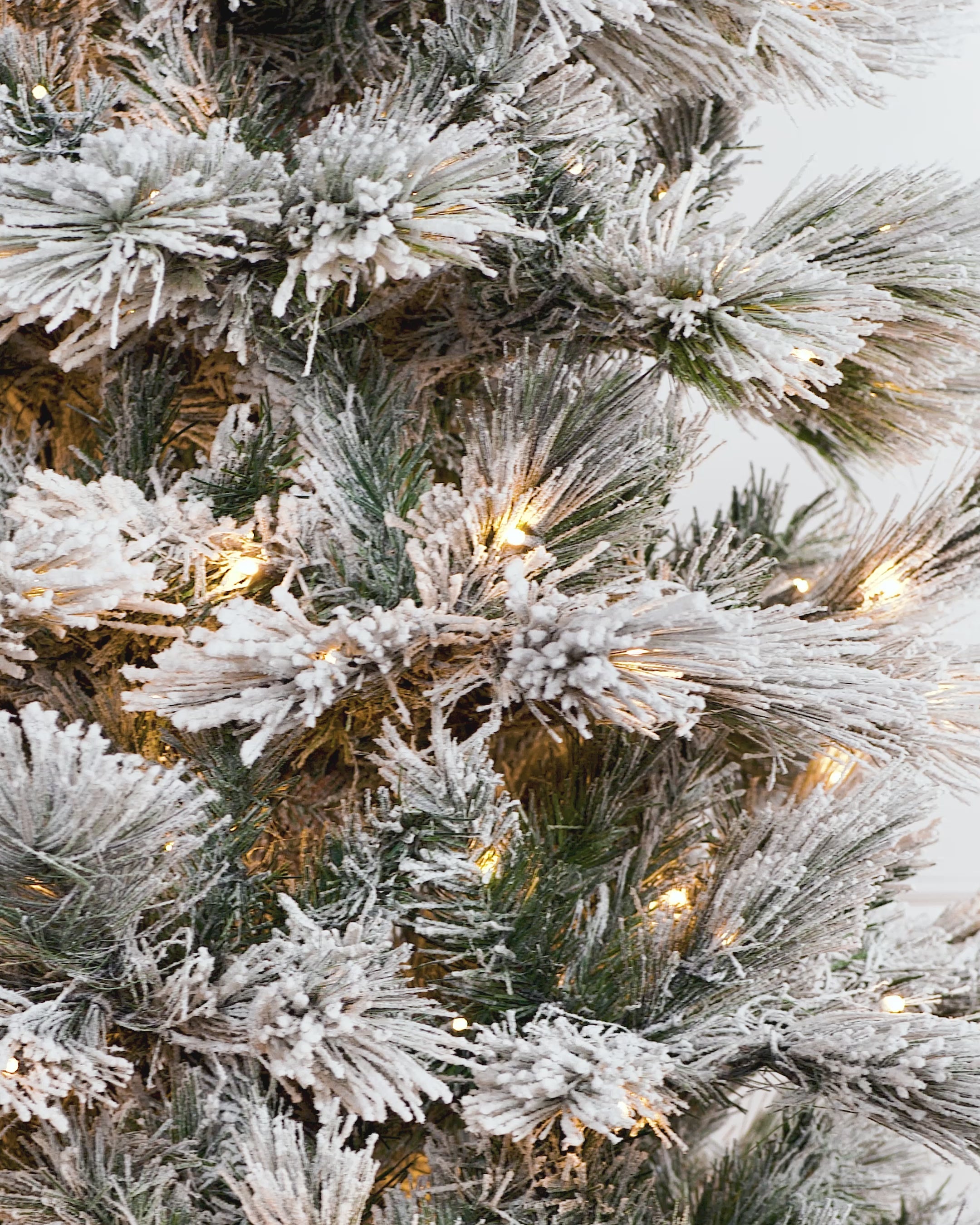 Load video: Pre-Lit Snow Flocked Pine Needle Christmas Tree, 7 ft