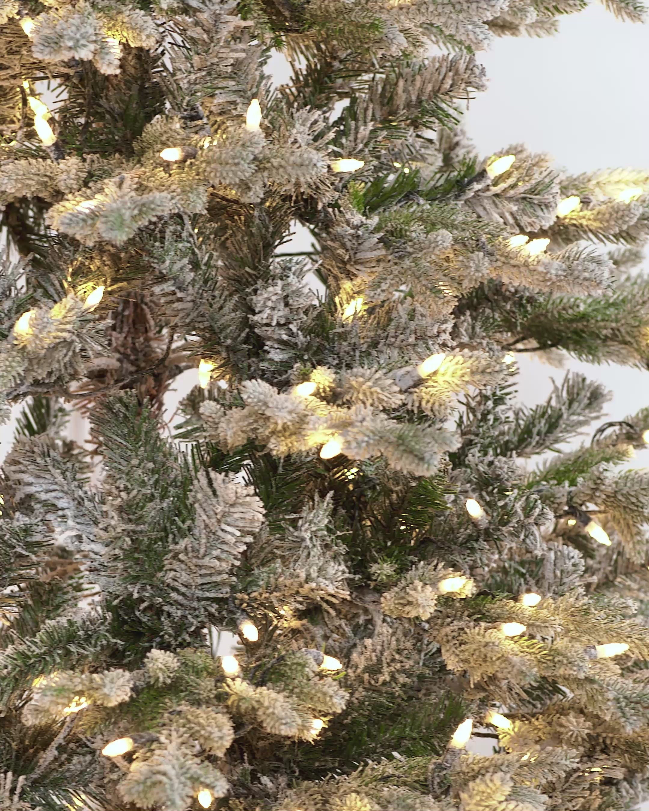 Load video: Pre-Lit Snow Flocked Fraser Fir Christmas Tree, 7 ft