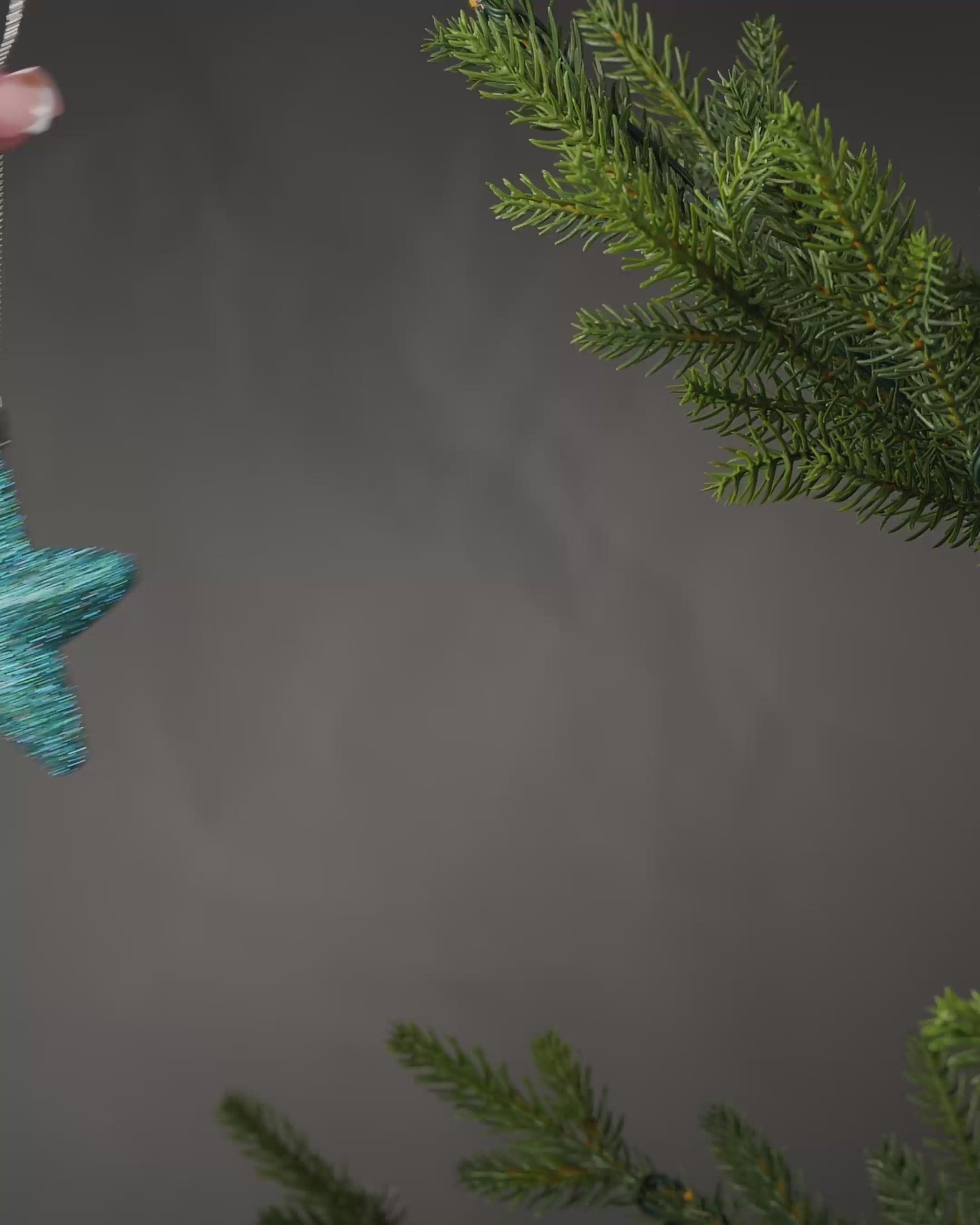 Load video: Set of 12 Hanging Stars, Teal, 7 cm