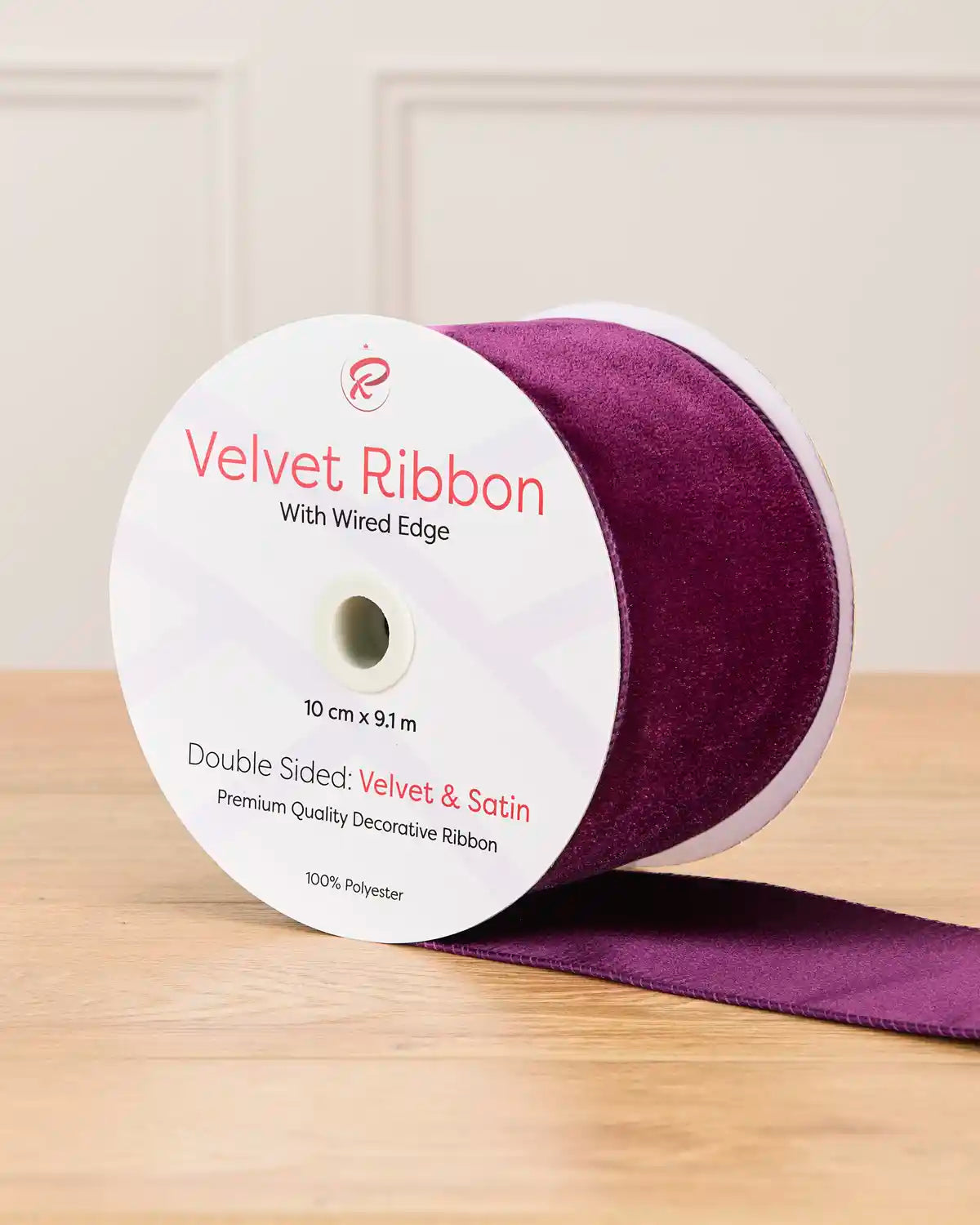 10 cm wide purple double-sided wired velvet ribbon on a 9 m roll with product label.