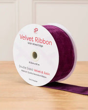 6 cm wide purple double-sided wired velvet ribbon on a 9 m roll with product label.