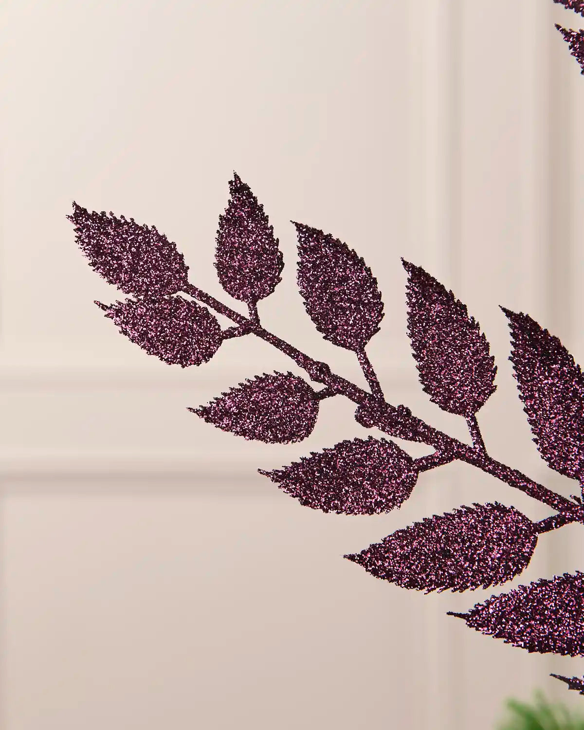 Detailed close-up of the sparkling purple leaves on the 73 cm Christmas tree spray.