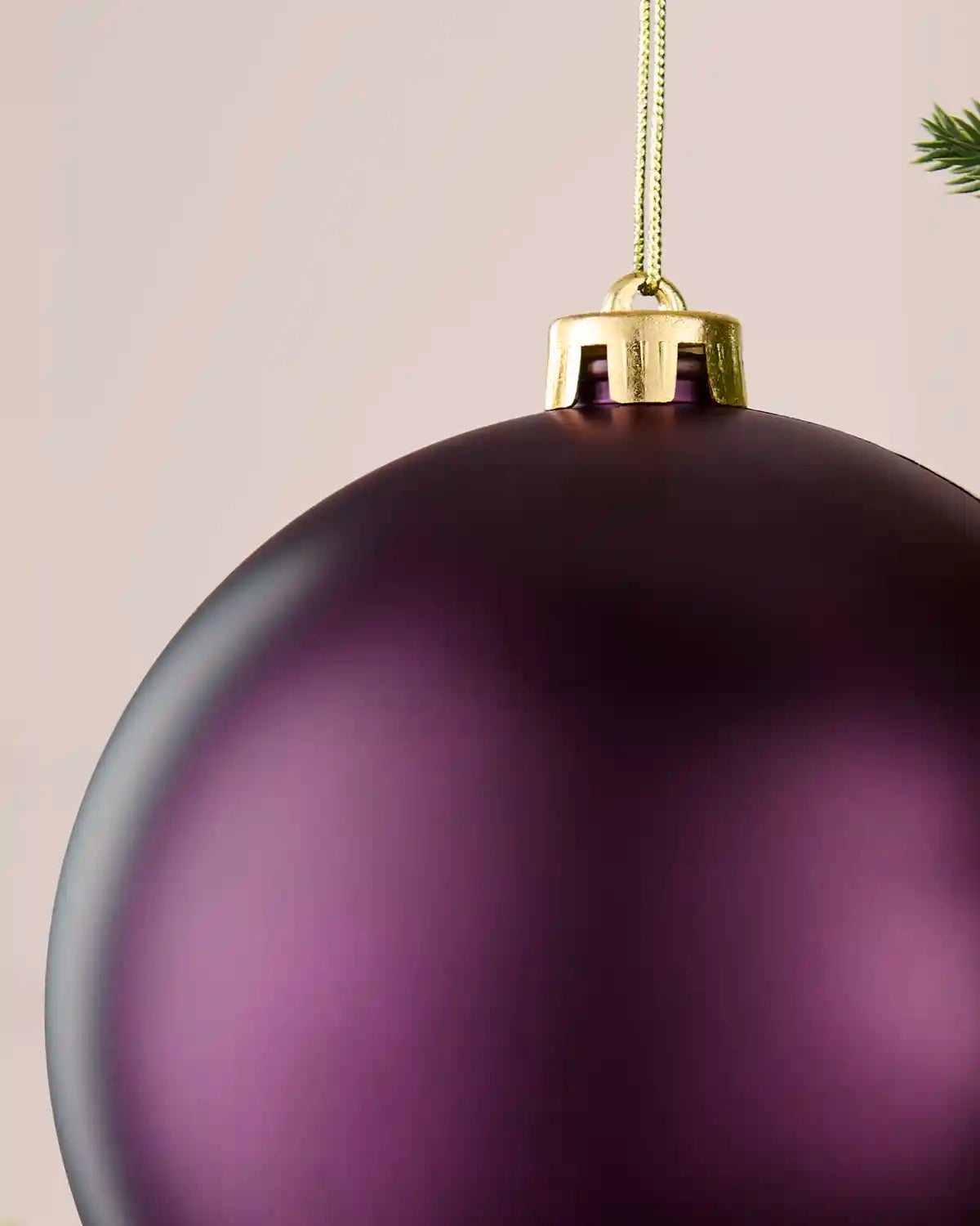 Detailed close-up of the 15 cm purple matt shatterproof bauble showing the gold cap, hanging string and smooth finish.