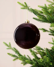 Purple 15 cm oversized shatterproof bauble with a shiny finish, gold cap and hanging string displayed on a Christmas tree.