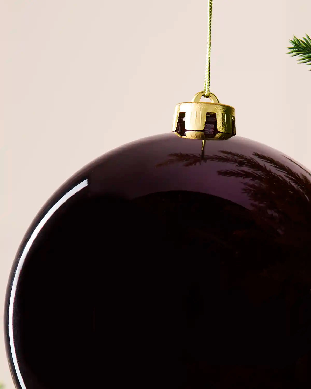 Detailed close-up of the 15 cm purple shiny shatterproof bauble showing the gold cap, hanging string and glossy finish.