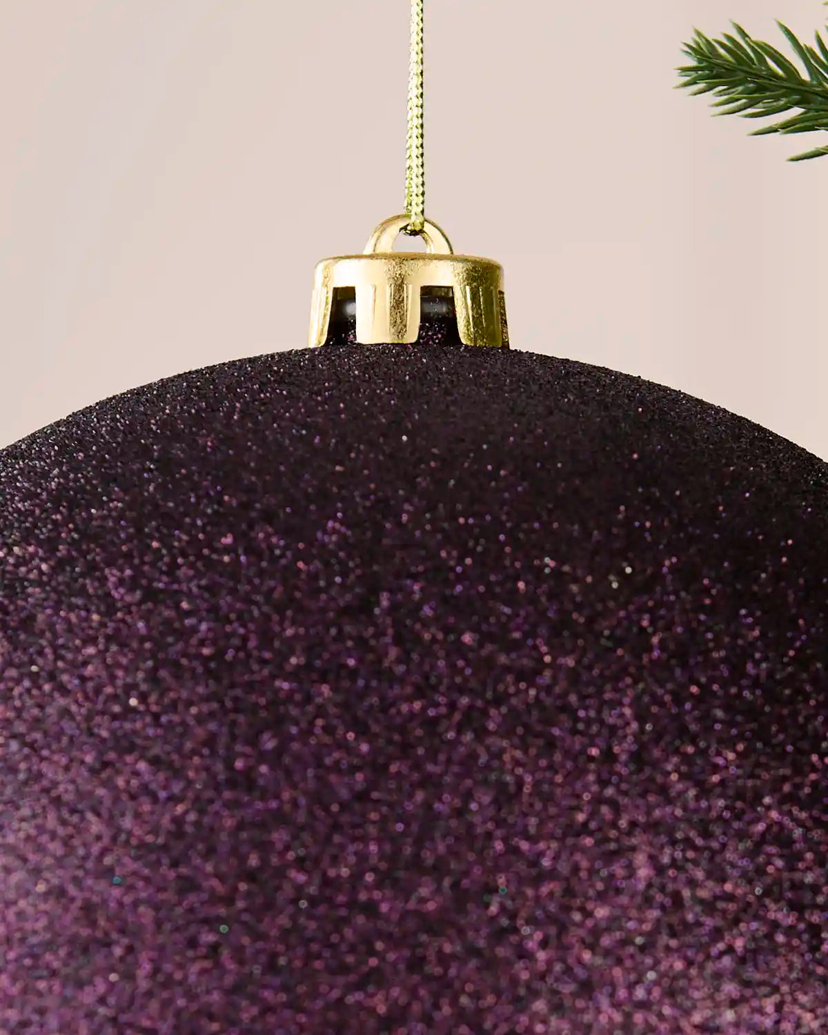 Detailed close-up of the 20 cm purple glitter shatterproof bauble showing the gold cap, hanging string and sparkling finish.