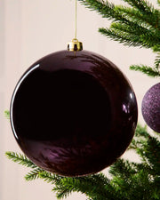 Purple 20 cm oversized shatterproof bauble with a shiny finish, gold cap and hanging string displayed on a Christmas tree.
