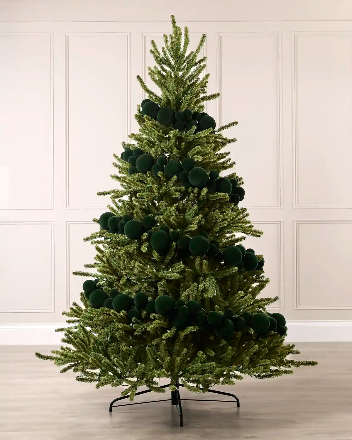 Sage green velvet bauble garland wrapped around a green Christmas tree with mixed 5cm, 7cm and 10cm baubles.