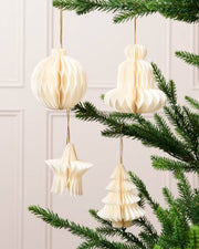 Off-white paper bauble, bell, star and Christmas tree decorations displayed on a Christmas tree.