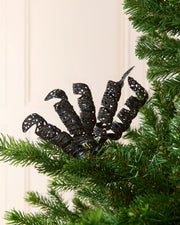Set of three 18 cm black glitter spiral picks arranged among green Christmas tree branches.