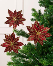 Set of three 15 cm burgundy glitter poinsettias with gold detailing displayed on a Christmas tree.