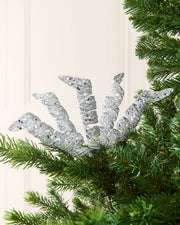 Set of three 18 cm silver glitter spiral picks arranged among green Christmas tree branches.