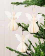 Off-white paper angel decorations from a set of six displayed on a Christmas tree.