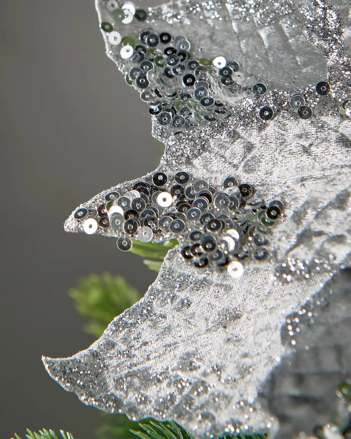 Close-up of the sequin and glitter detail on the silver poinsettia petals