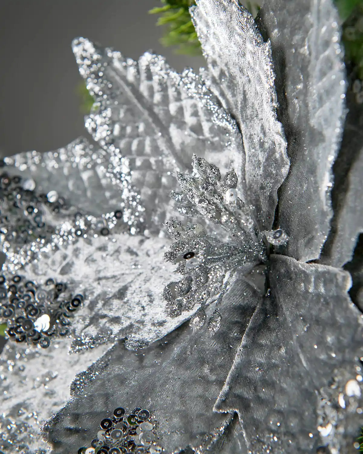 Close-up of the textured silver petals on the artificial poinsettia flower