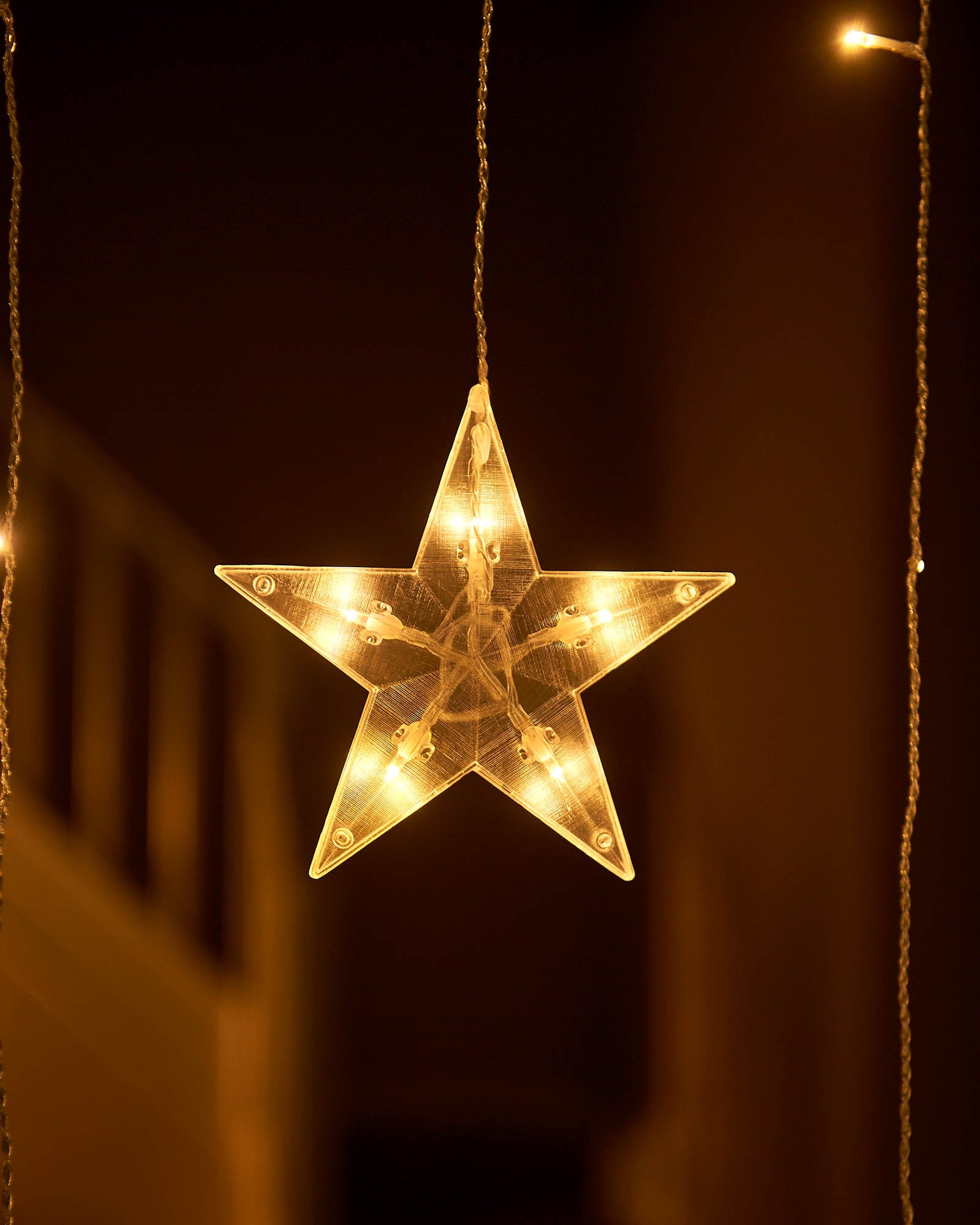 Close-up of a solid warm white star light with clear textured plastic and visible LEDs