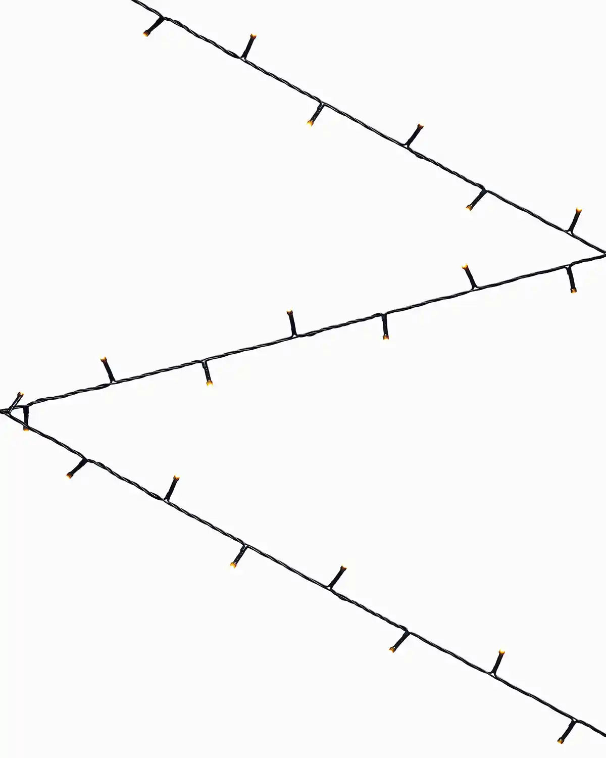 warm white lights in a zig zag formation against a white background